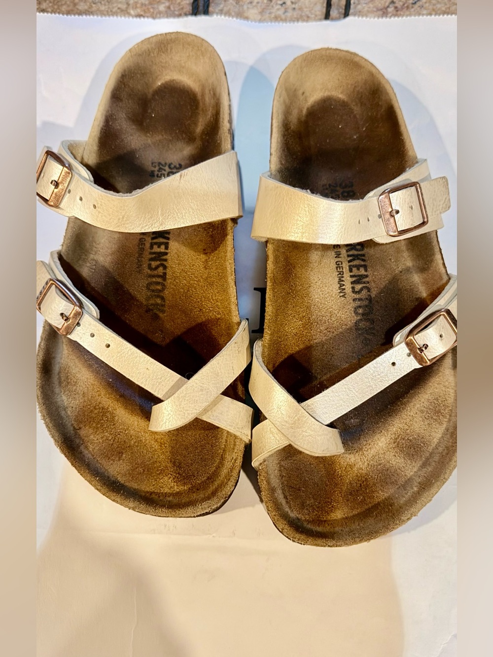 Birkenstock Metallic Cream Cross-Strap Sandals with Rose Gold Buckles